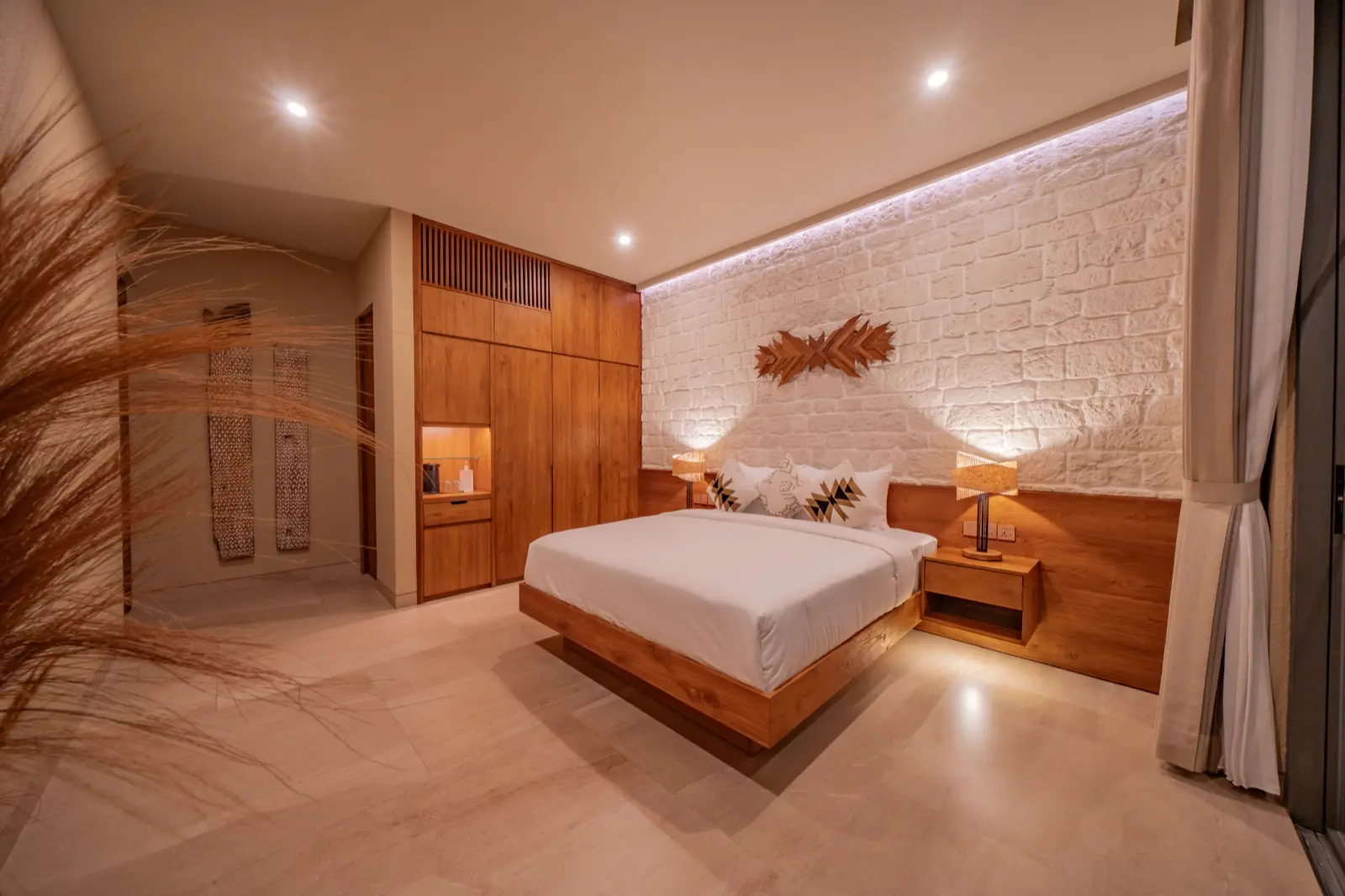 Timber joinery beside the bed in bedroom three at Villa Navaho