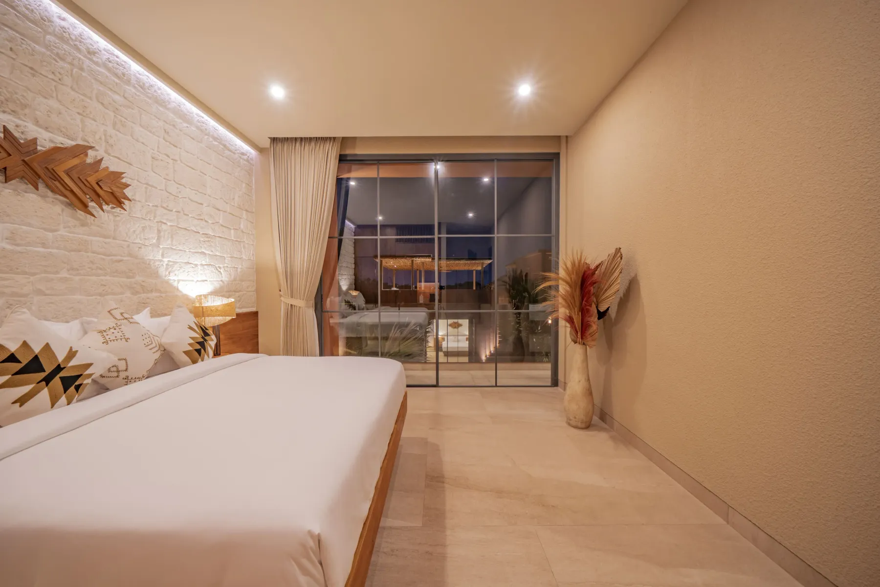Third bedroom with glass doors onto the terrace at Villa Navaho, Bumbak Bali