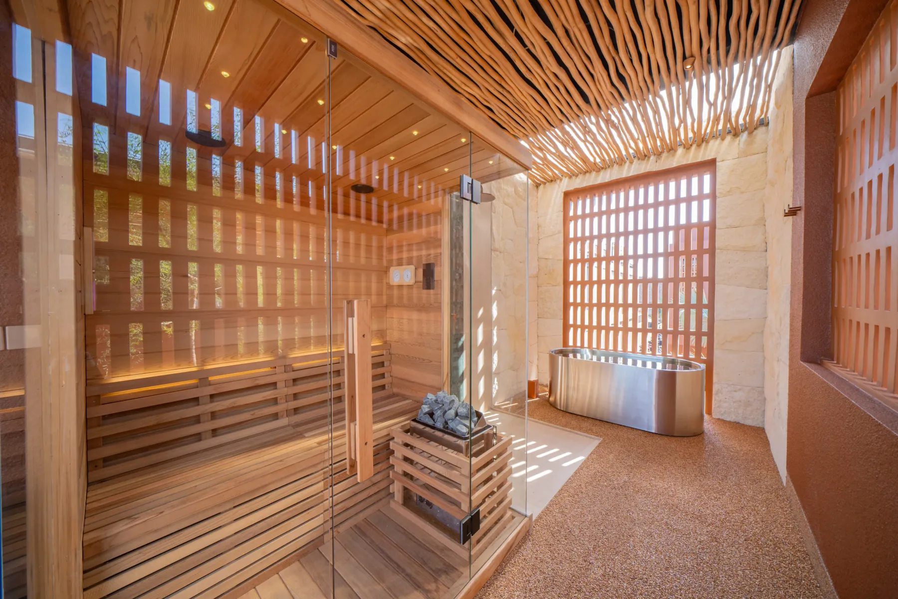 Cold plunge tub beside the sauna cabin in a limestone corridor, Villa Navaho