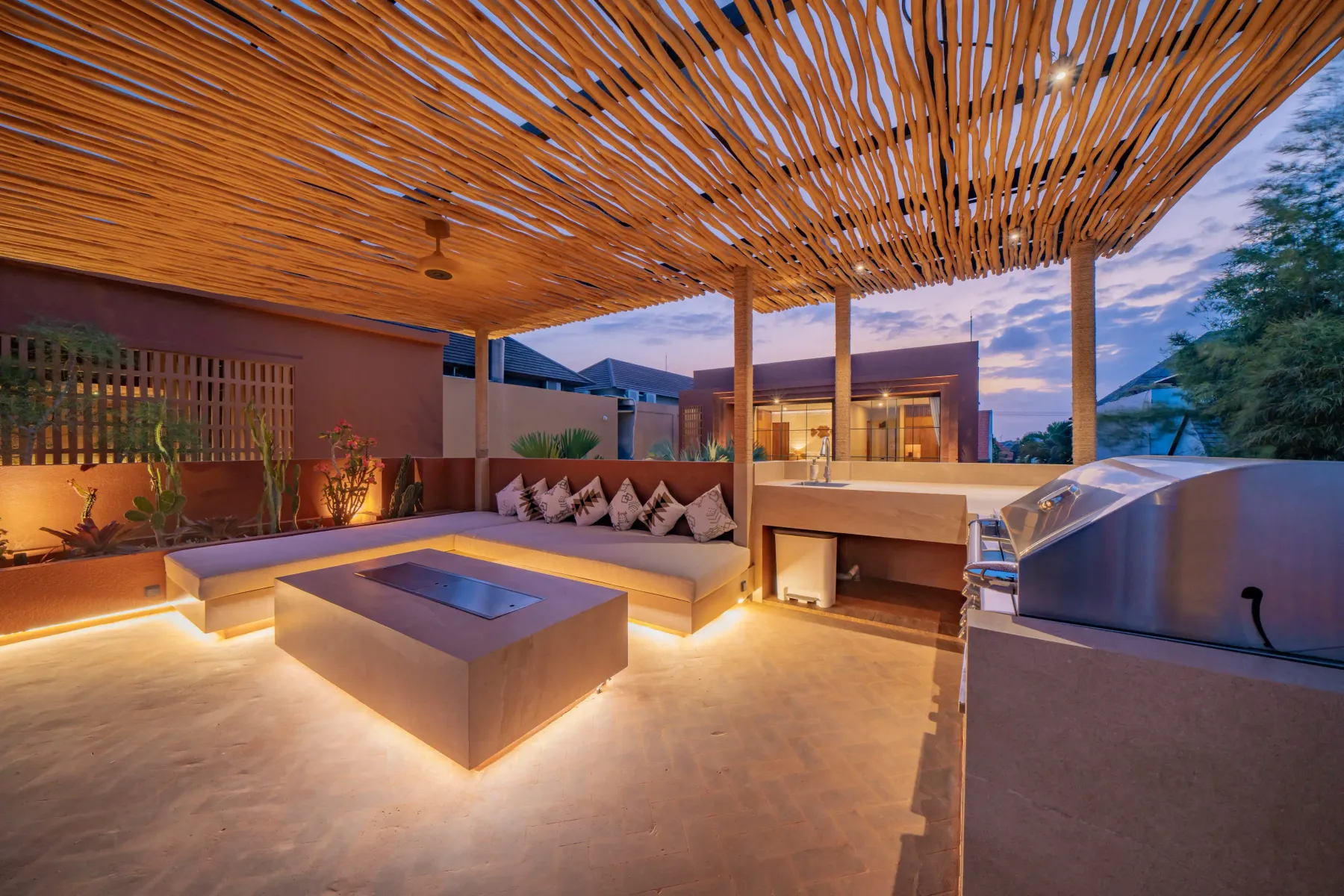 Rooftop lounge seating and barbecue facing the sunset at Villa Navaho, Bumbak Bali