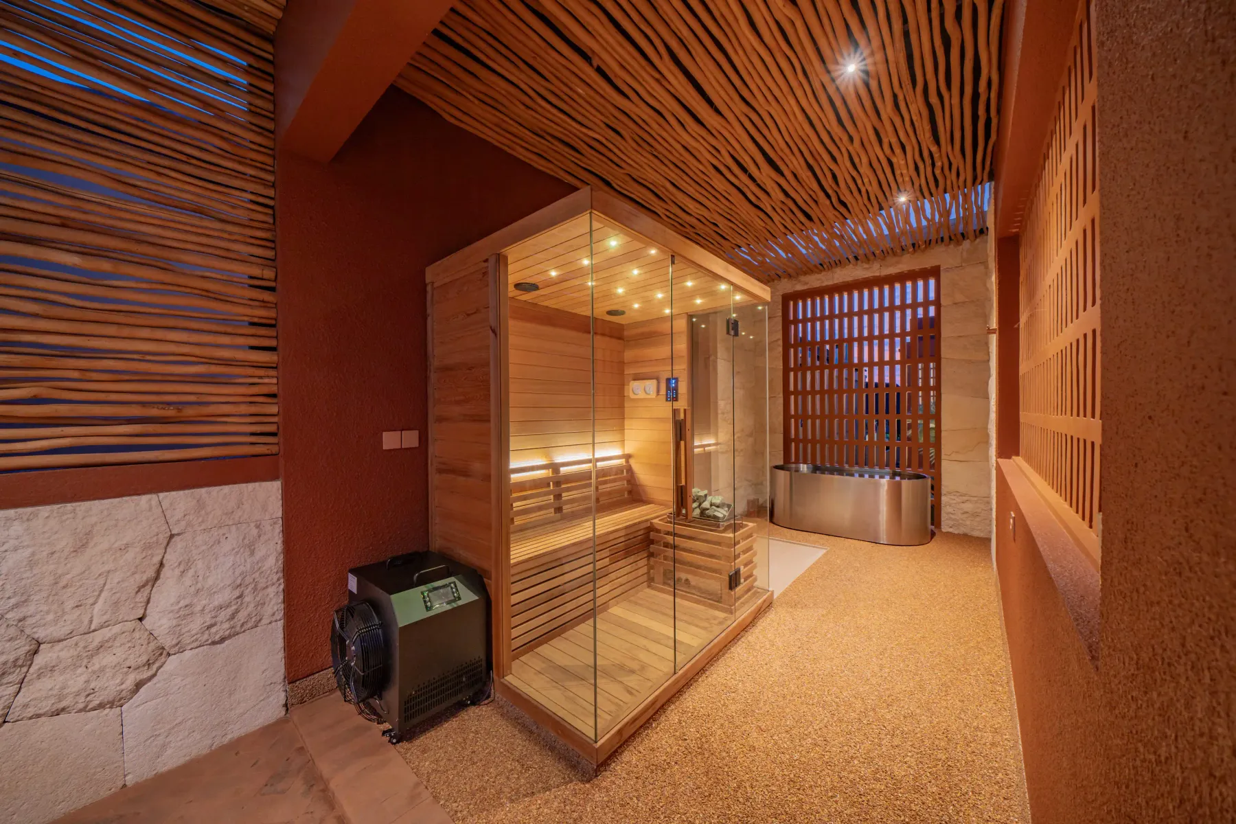 Glass-fronted sauna cabin beside the plunge tub at Villa Navaho, Bumbak Bali