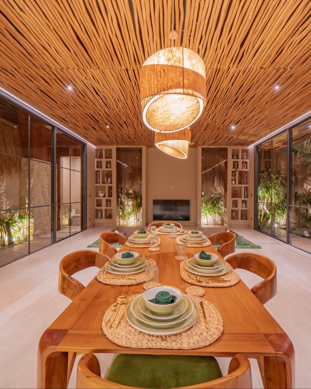 Arched living and dining space in warm clay tones at Villa Navaho