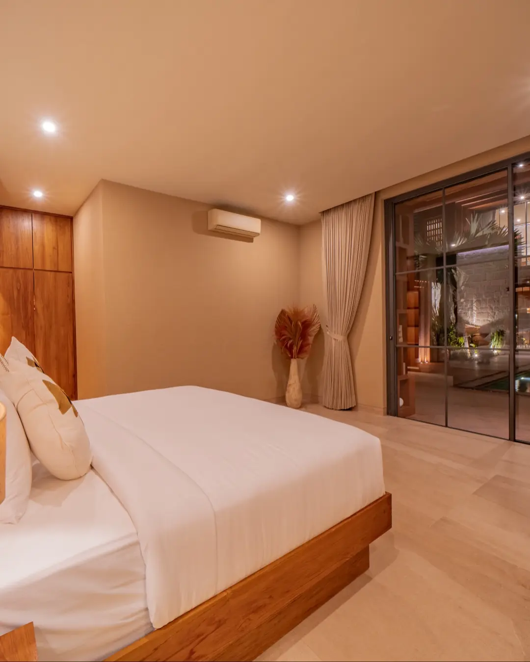 Master suite in organic linen and warm wood, Villa Navaho Bumbak Bali